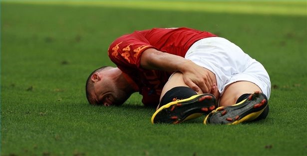 Sports person lying on ground from injury