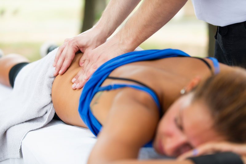 Women getting a massage after sports game